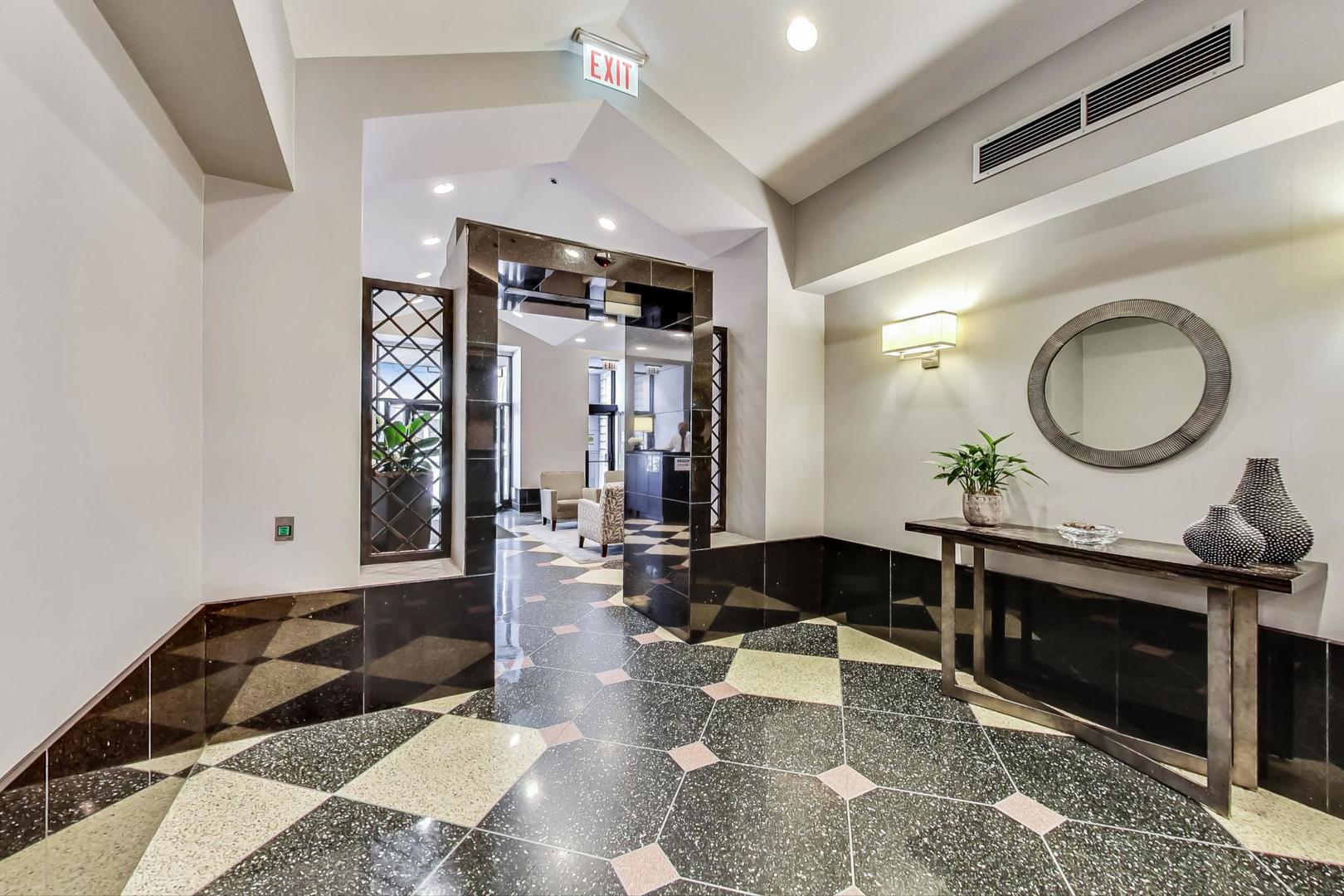 111 West Maple Street, Unit 1410 Chicago, IL 60610 - Photo 11 of 41 a living room with furniture