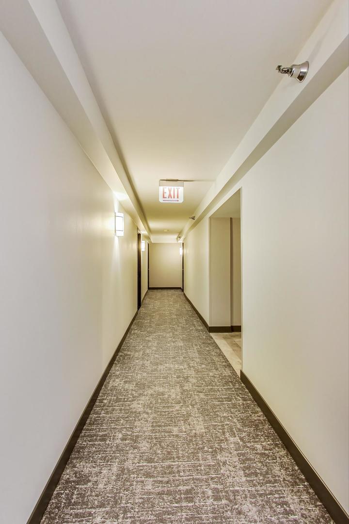 111 West Maple Street, Unit 1410 Chicago, IL 60610 - Photo 14 of 41 a view of a big room with closet and windows