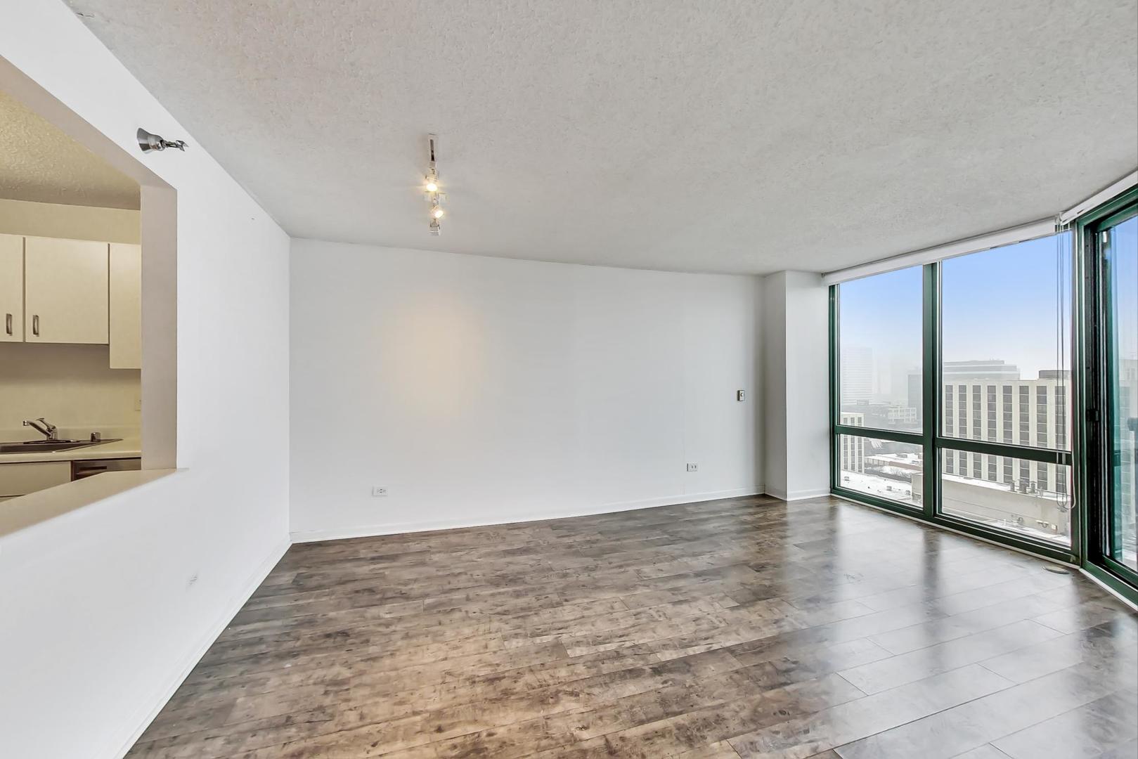 111 West Maple Street, Unit 1410 Chicago, IL 60610 - Photo 20 of 41 a view of an empty room with a window