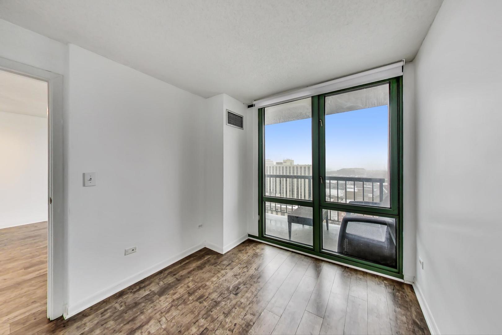111 West Maple Street, Unit 1410 Chicago, IL 60610 - Photo 27 of 41 wooden floor in an empty room