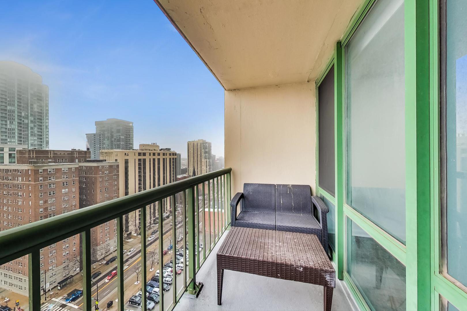 111 West Maple Street, Unit 1410 Chicago, IL 60610 - Photo 31 of 41 a view of a balcony with wooden floor