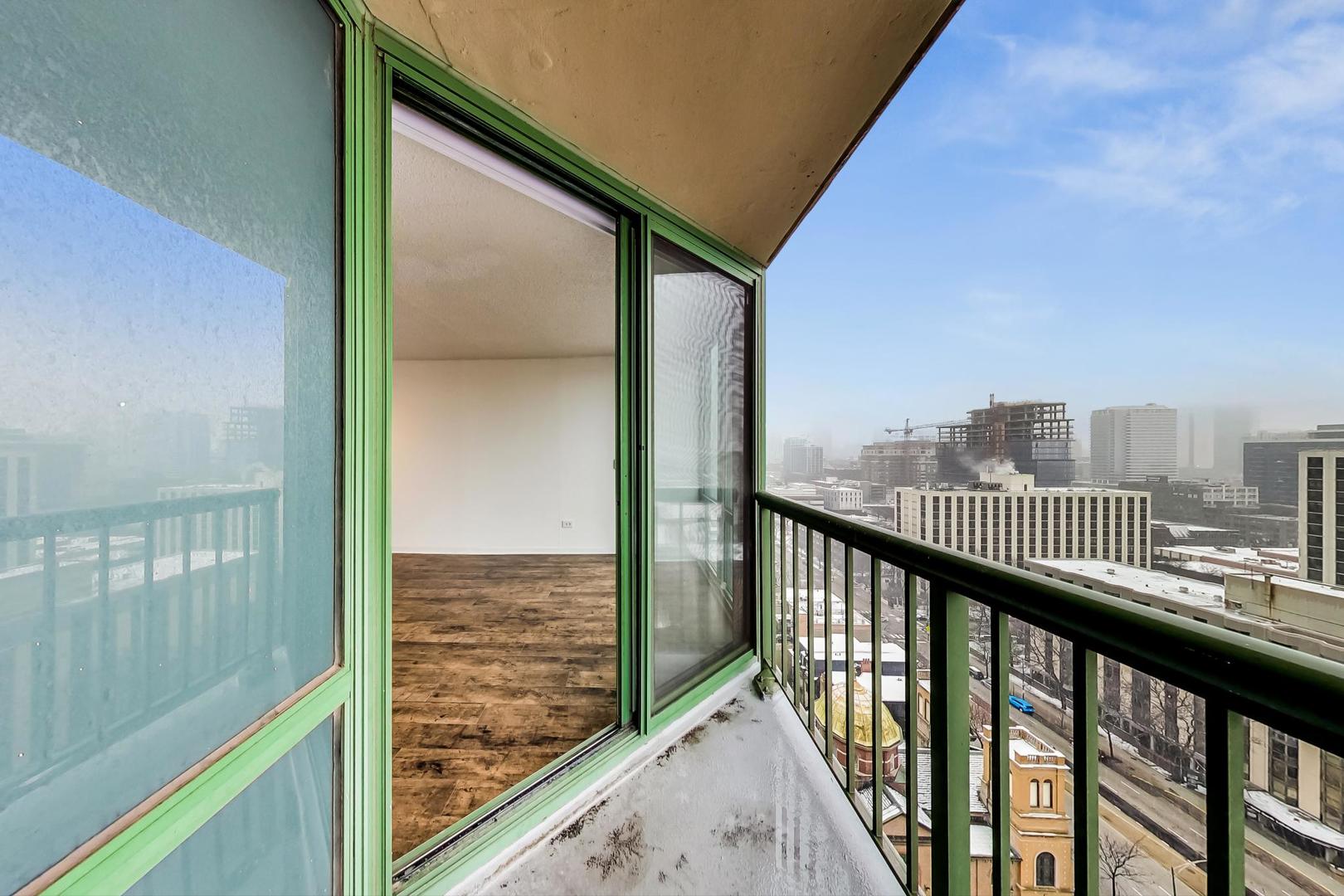 111 West Maple Street, Unit 1410 Chicago, IL 60610 - Photo 32 of 41 a view of city from a balcony