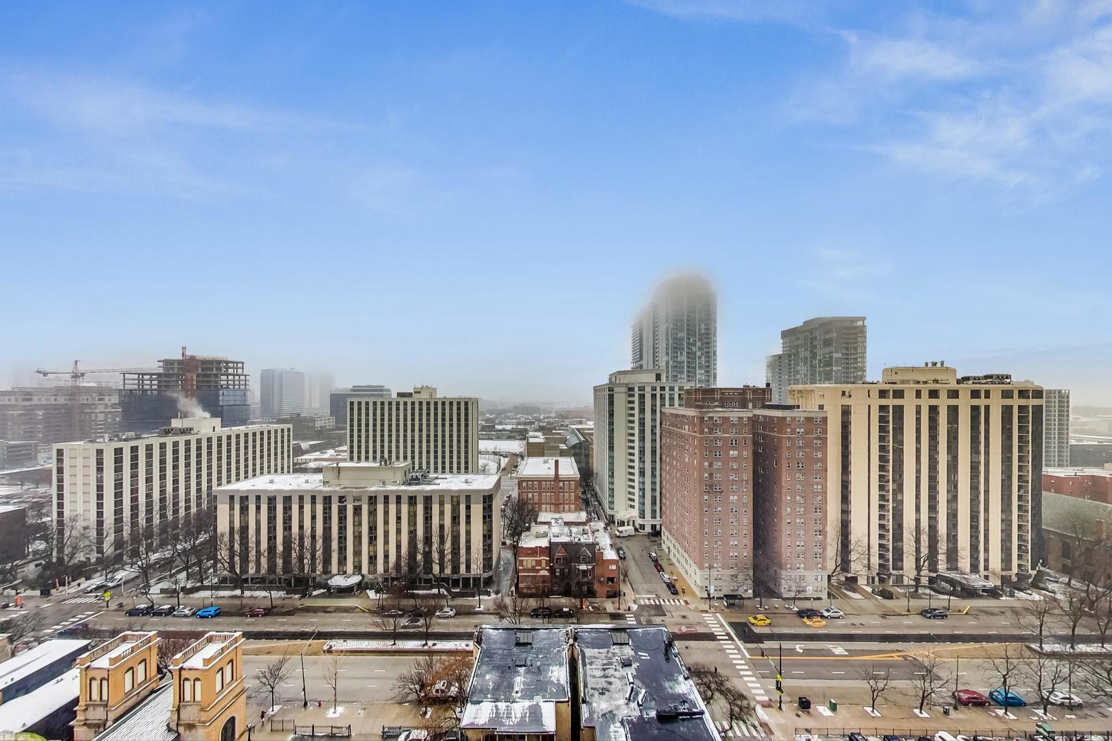 111 West Maple Street, Unit 1410 Chicago, IL 60610 - Photo 33 of 41 a view of a city with tall buildings