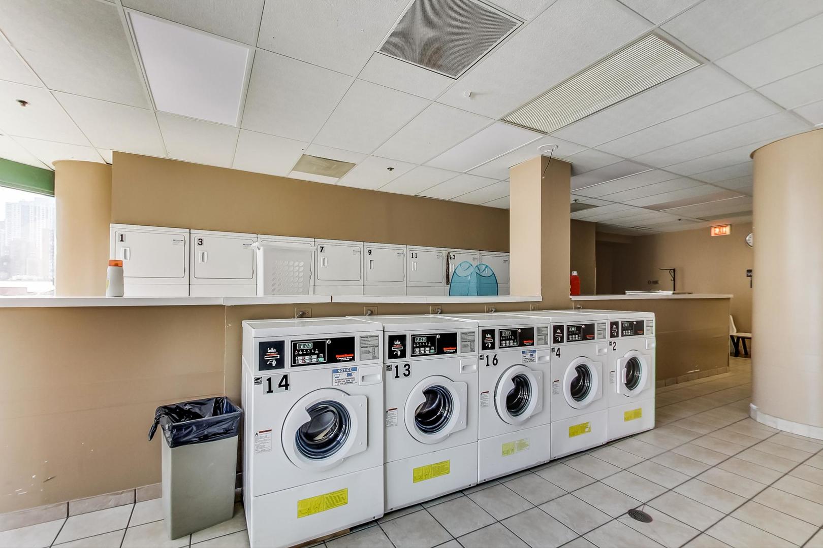 111 West Maple Street, Unit 1410 Chicago, IL 60610 - Photo 34 of 41 a kitchen with stainless steel appliances granite countertop a stove and a refrigerator