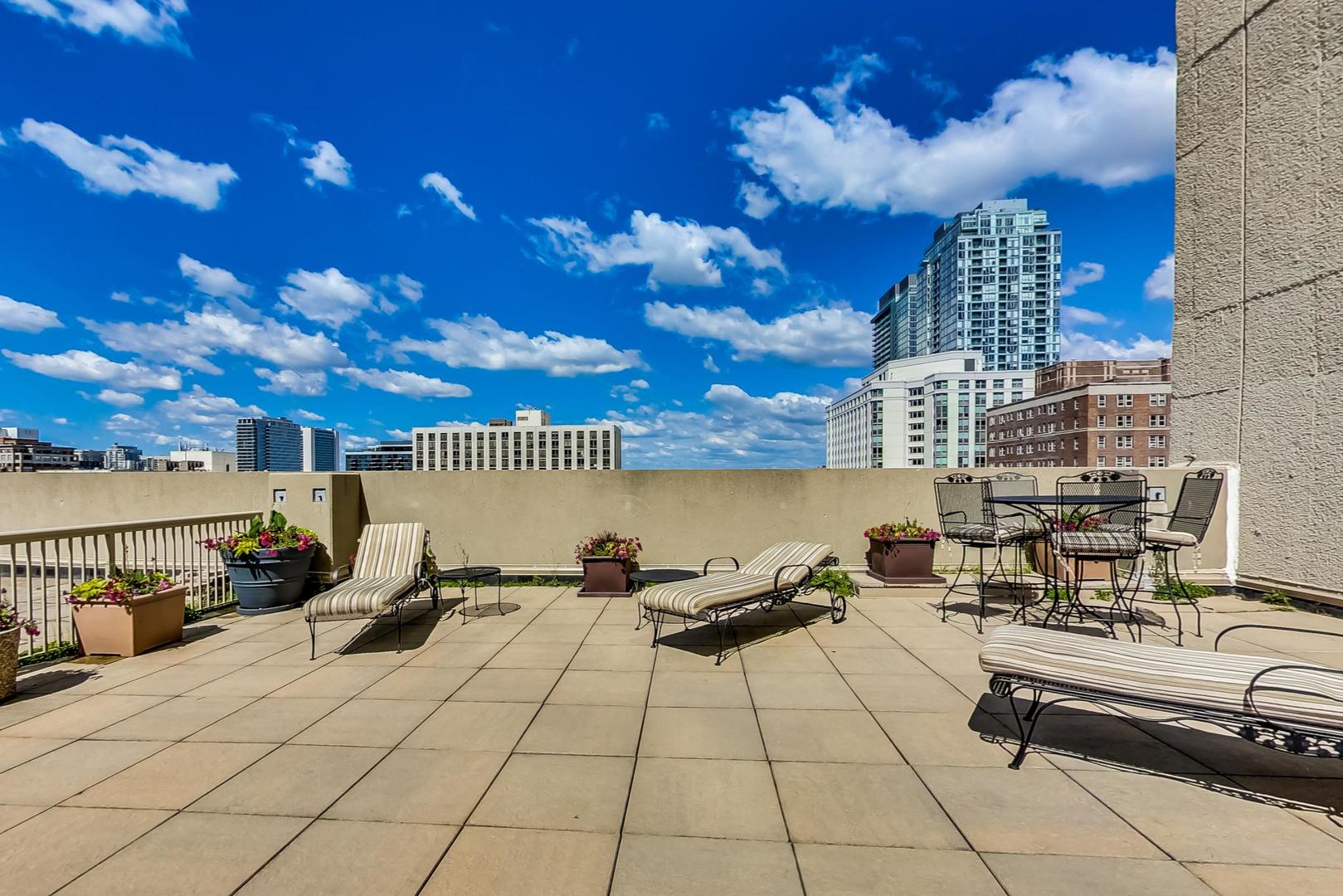 111 West Maple Street, Unit 1410 Chicago, IL 60610 - Photo 38 of 41 a view of a terrace with seating area