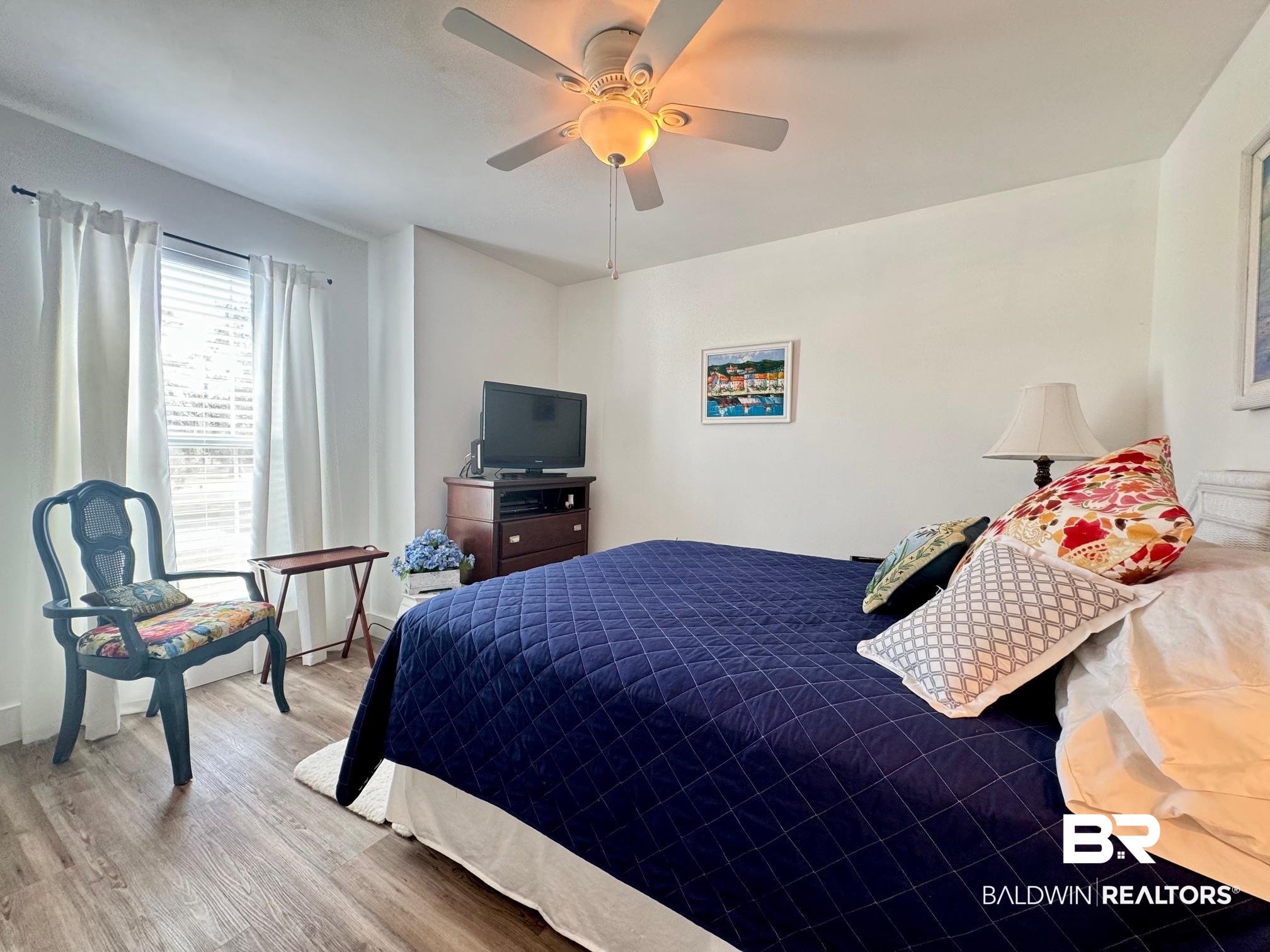 3200 Loop Road, Unit 55 Orange Beach, AL 36561 - Photo 22 of 40 Bedroom featuring hardwood / wood-style flooring and ceiling fan