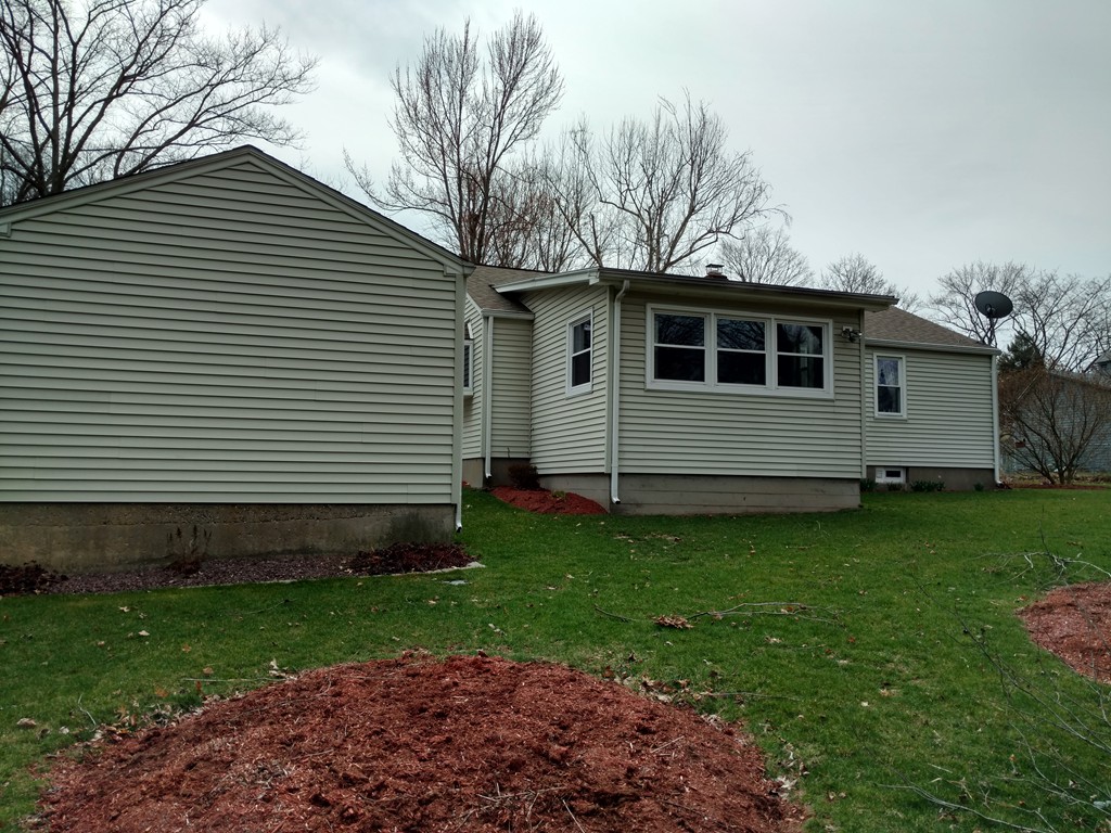 18 Whittaker Street Springfield, MA 01104 - Photo 2 of 2 a front view of a house with garden