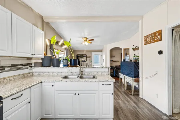 a view of living room with granite countertop furniture and fireplace