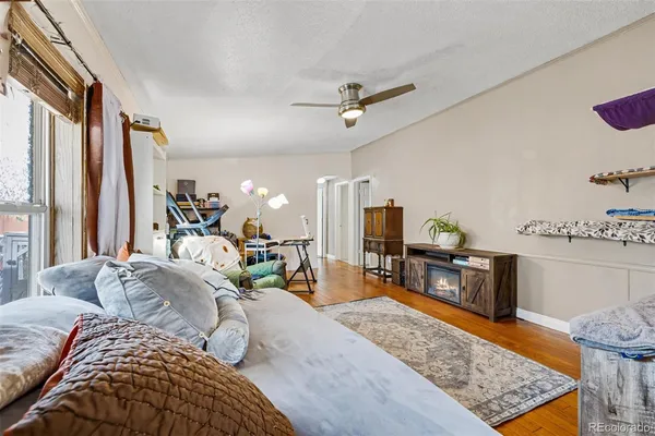 a bed room with a bed window and a couch