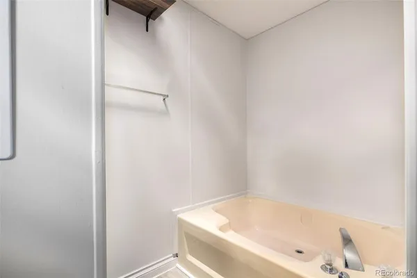 a bathroom with a tub and shower