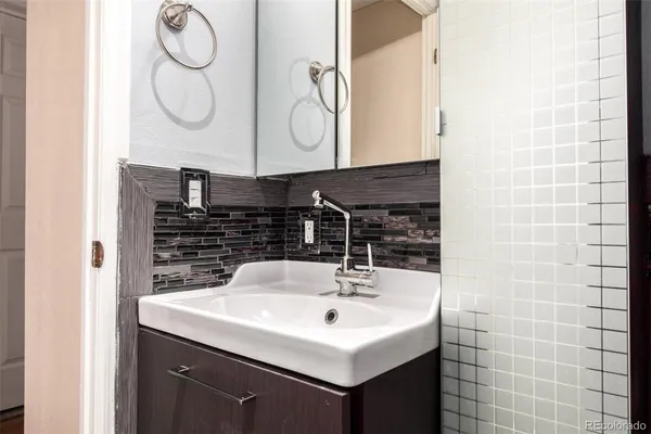 a bathroom with a sink and a mirror