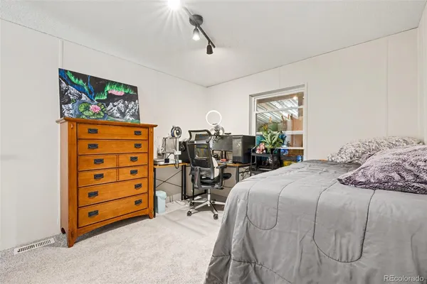 a bed room with a bed and a tv