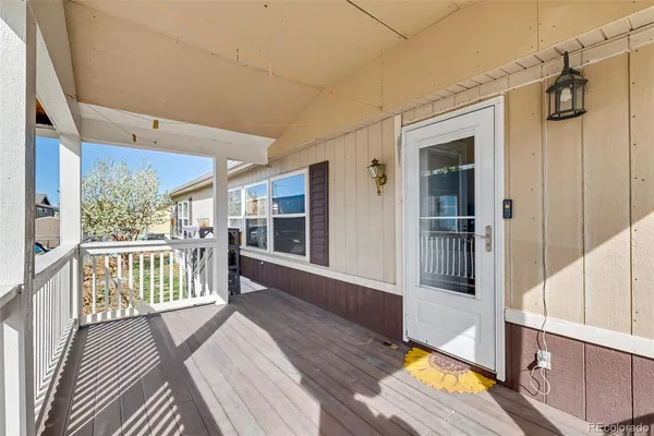 a view of a balcony with wooden floor