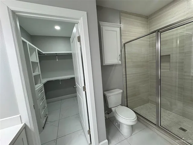 a view of an empty walk in closet