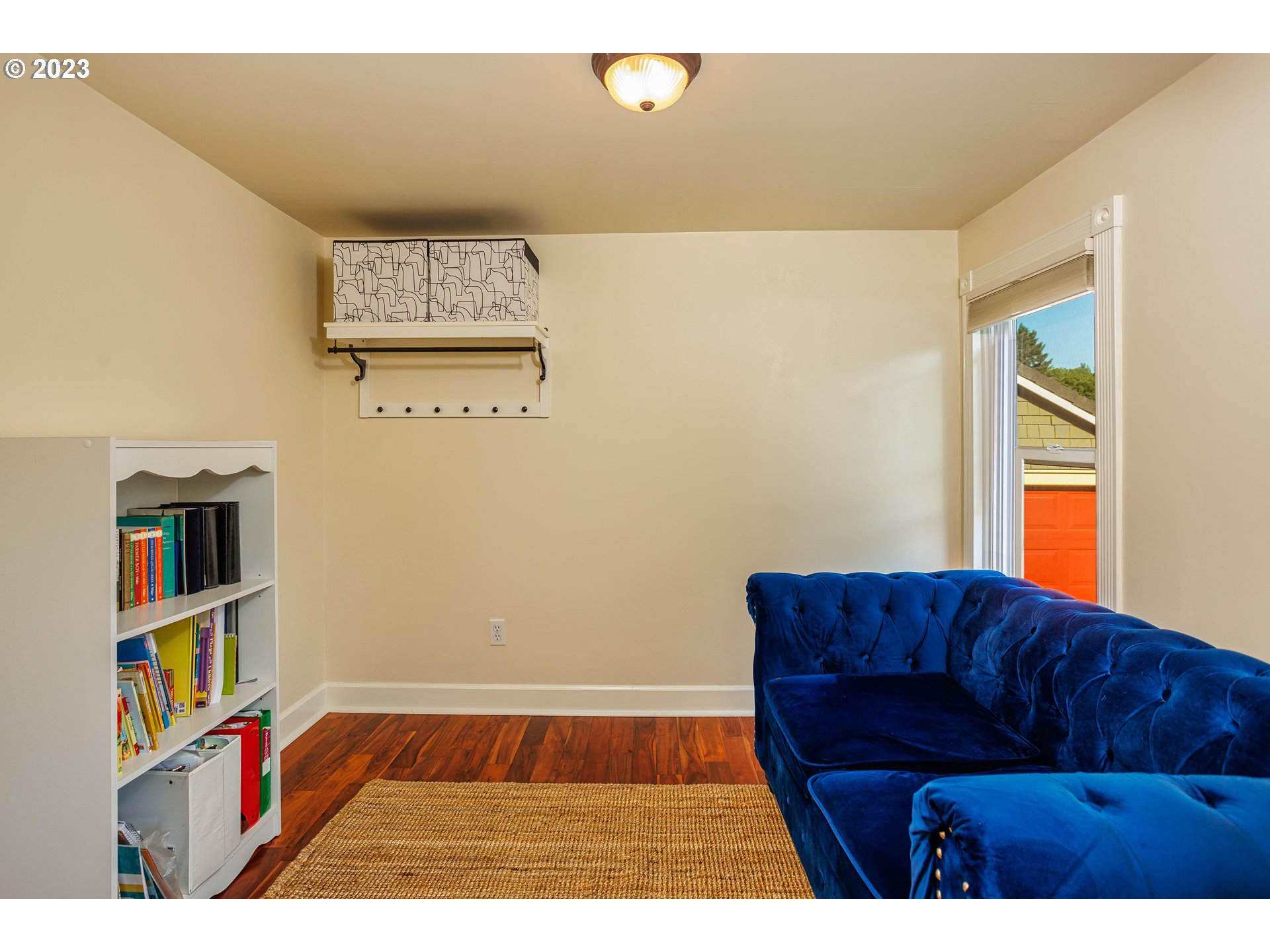 210 South 4th Avenue Ridgefield, WA 98642 - Photo 14 of 31 a living room with a couch and bookshelf
