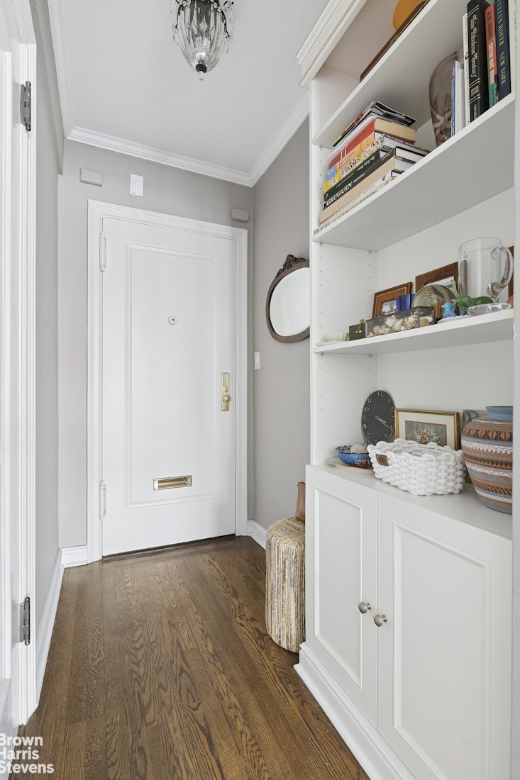 210 East 73rd Street, Unit 7F Manhattan, NY 10021 - Photo 12 of 13 a view of cabinets with wooden floor