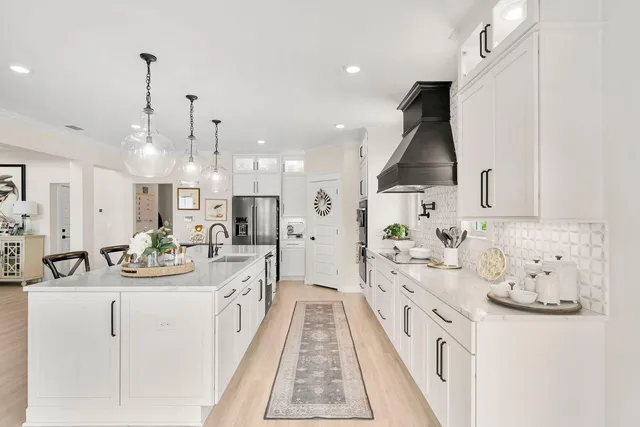 a spacious bedroom with a large bed and a flat screen tv