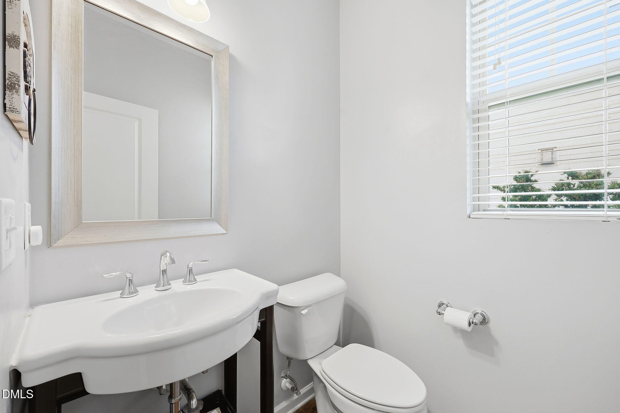 1808 Austin Rdg Parkway Wake Forest, NC 27587 - Photo 20 of 57 a bathroom with a sink a toilet and mirror