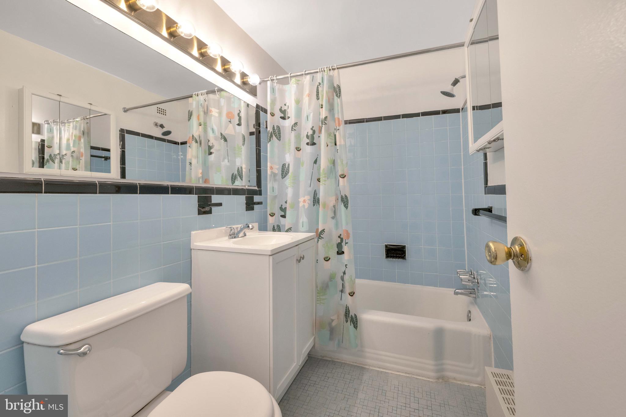 1200 South Arlington Ridge Road, Unit 503 Arlington, VA 22202 - Photo 12 of 17 a bathroom with a sink toilet and shower