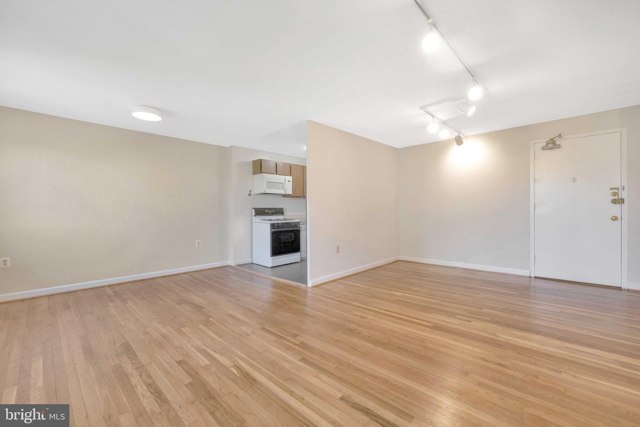 1200 South Arlington Ridge Road, Unit 503 Arlington, VA 22202 - Photo 6 of 17 a view of empty room with wooden floor