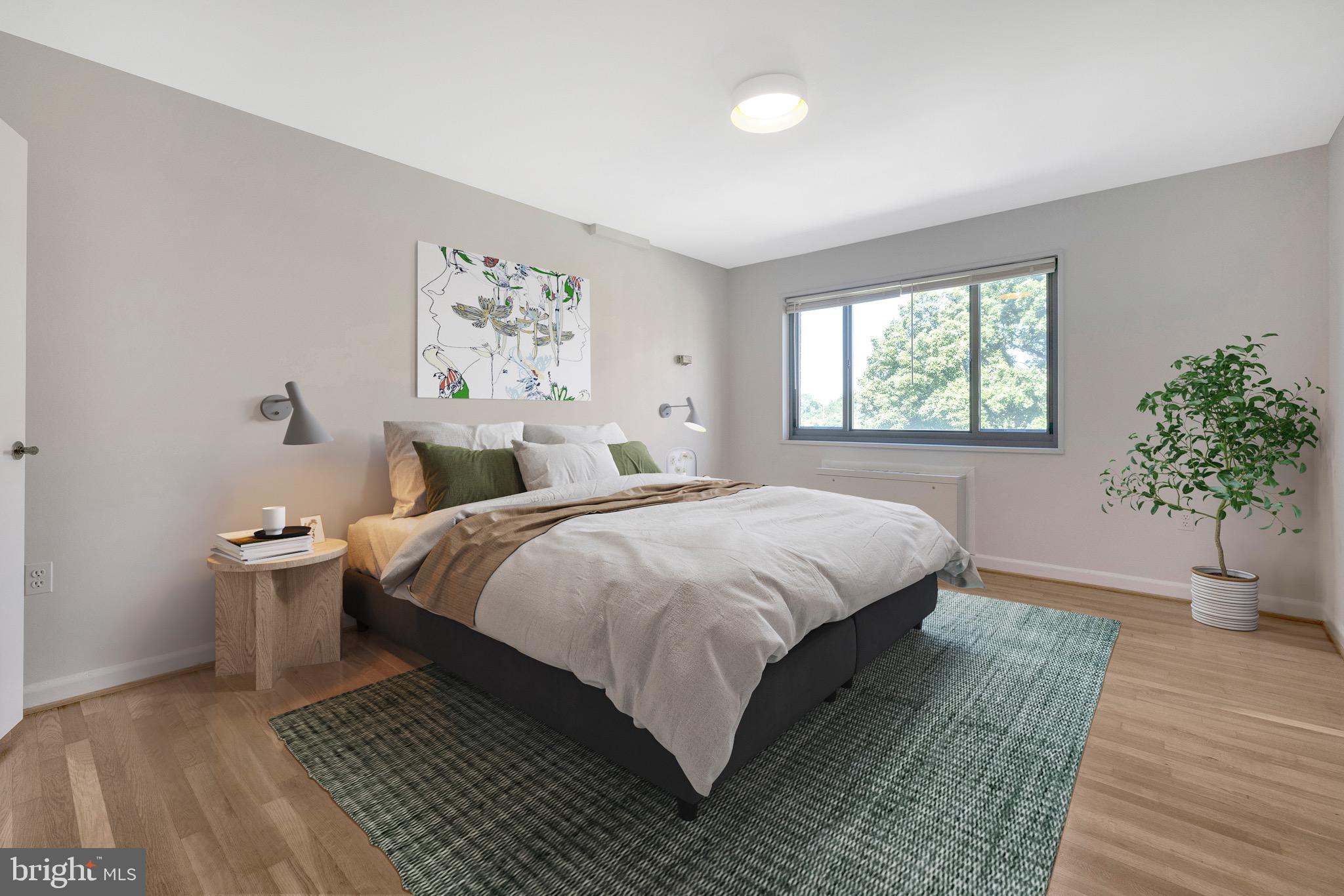 1200 South Arlington Ridge Road, Unit 503 Arlington, VA 22202 - Photo 8 of 17 a bedroom with a large bed and a window