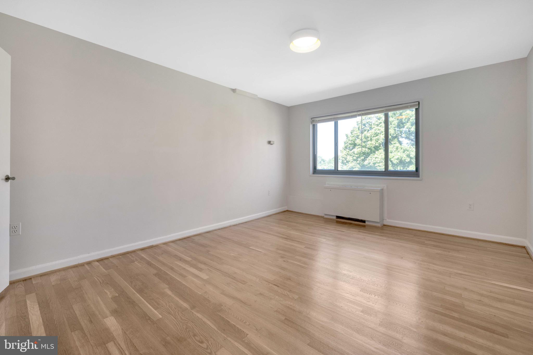 1200 South Arlington Ridge Road, Unit 503 Arlington, VA 22202 - Photo 9 of 17 an empty room with windows