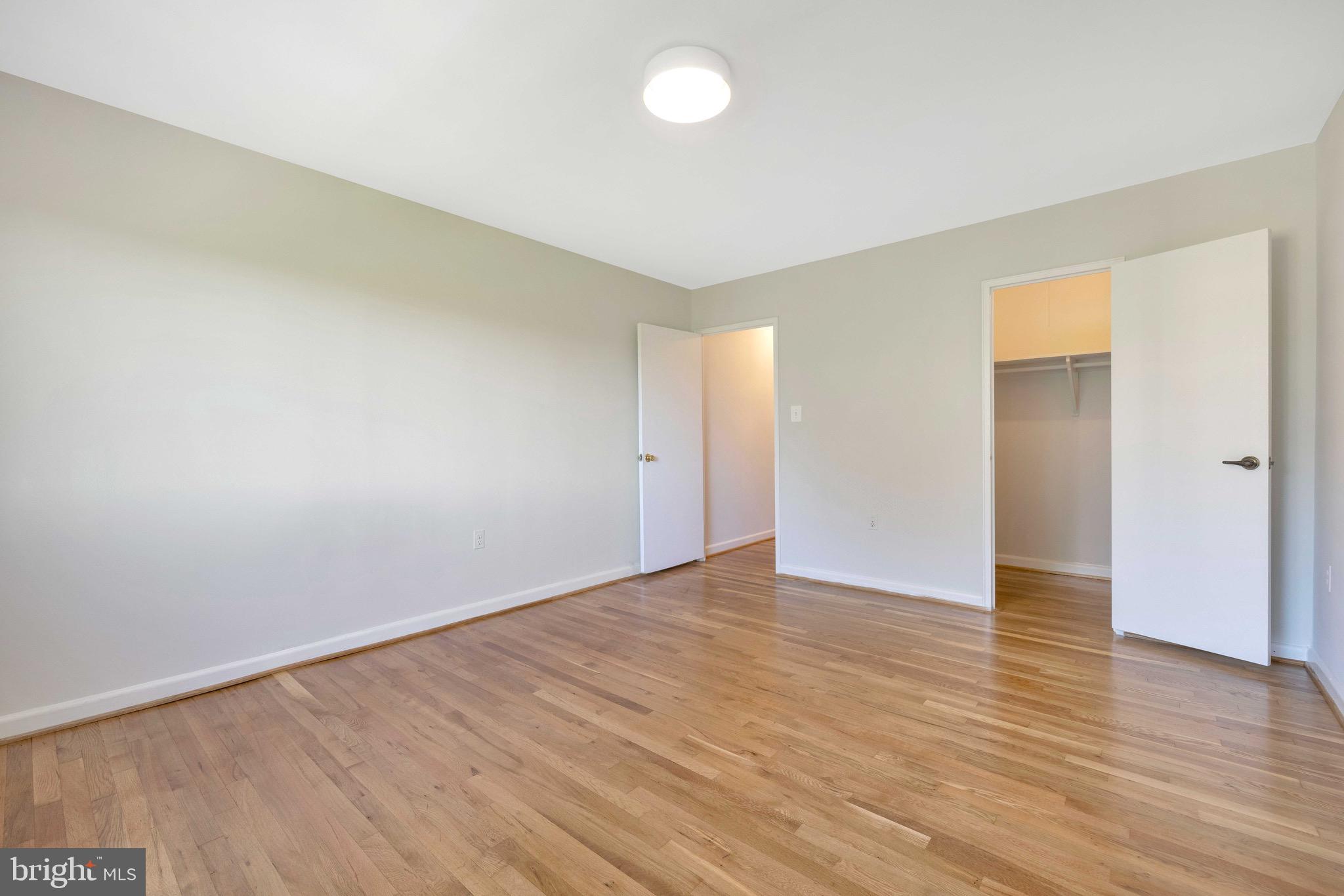 1200 South Arlington Ridge Road, Unit 503 Arlington, VA 22202 - Photo 10 of 17 a view of an empty room with wooden floor and a window