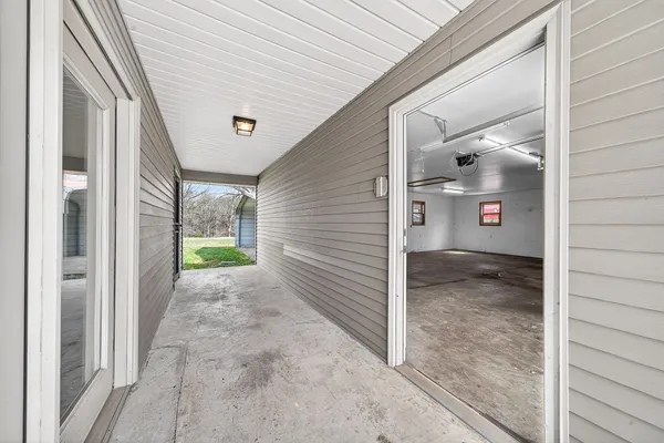 a view of balcony with wooden floor