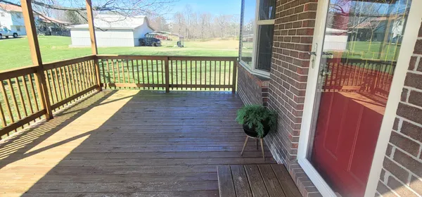 a balcony with wooden floor
