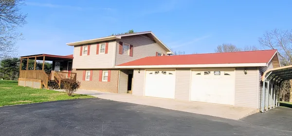 a house with garden in front of it