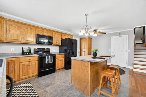 a kitchen with a table and chairs in it