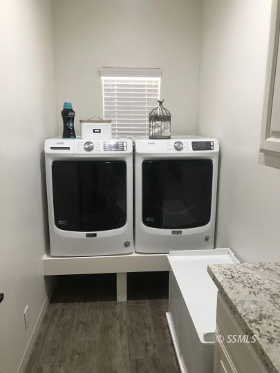124 Rancho Del Cerro Ridgecrest, CA 93555 - Photo 16 of 21 a utility room with dryer and washer