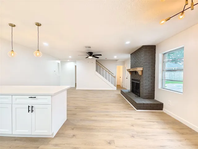 a view of a kitchen with furniture and a fireplace