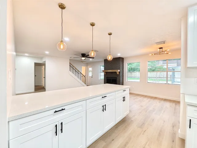 a spacious kitchen with stainless steel appliances kitchen island a large island in the center