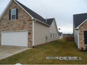 83 West Hiawassee Road Fletcher, NC 28732 - Photo 2 of 2 a view of a house with a backyard