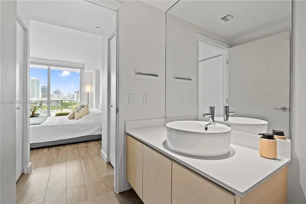 a bathroom with a sink and a mirror
