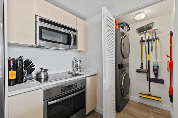 a kitchen with a sink and a stove top oven