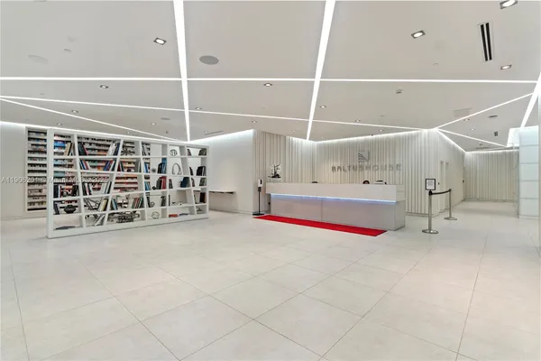 a view of an empty room with white walls