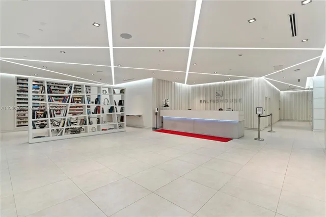 a view of an empty room with white walls