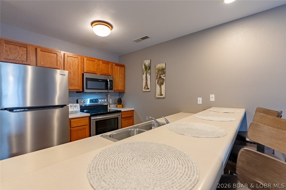 100 Osage Hills Road, Unit 504 Lake Ozark, MO 65049 - Photo 12 of 55 Breakfast bar seating