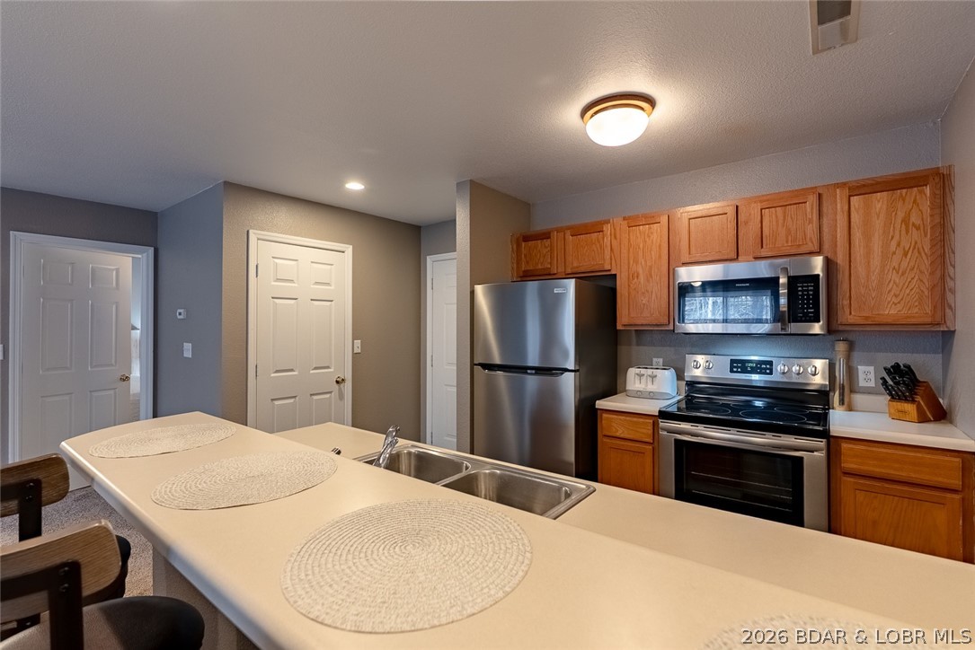 100 Osage Hills Road, Unit 504 Lake Ozark, MO 65049 - Photo 20 of 55 Laundry door right off kitchen