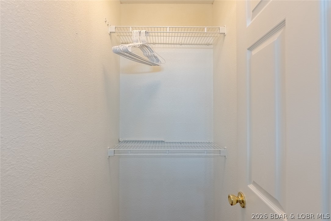 100 Osage Hills Road, Unit 504 Lake Ozark, MO 65049 - Photo 28 of 55 Large walk in closet in primary suite