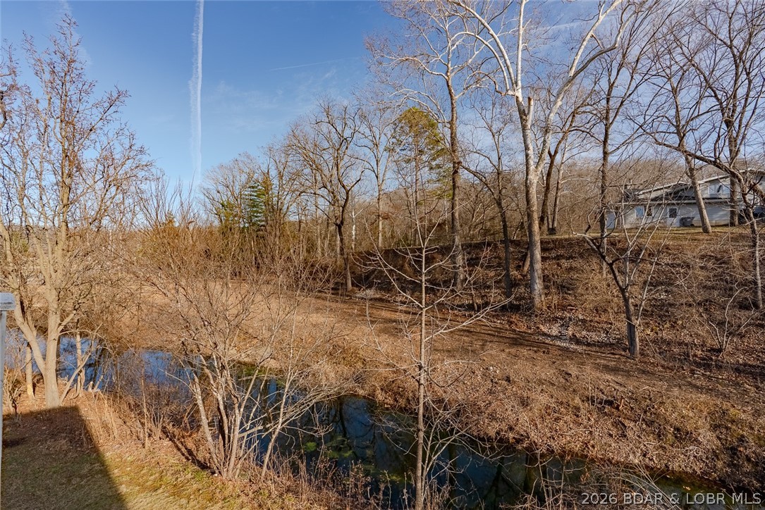 100 Osage Hills Road, Unit 504 Lake Ozark, MO 65049 - Photo 39 of 55 View of creek and woods from deck, very private