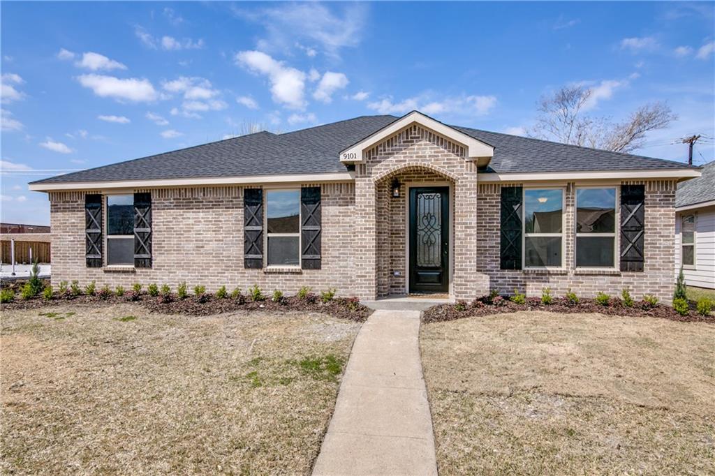 9101 Shipman Street Rowlett, TX 75088 - Photo 1 of 1 a front view of a house with a garden and yard