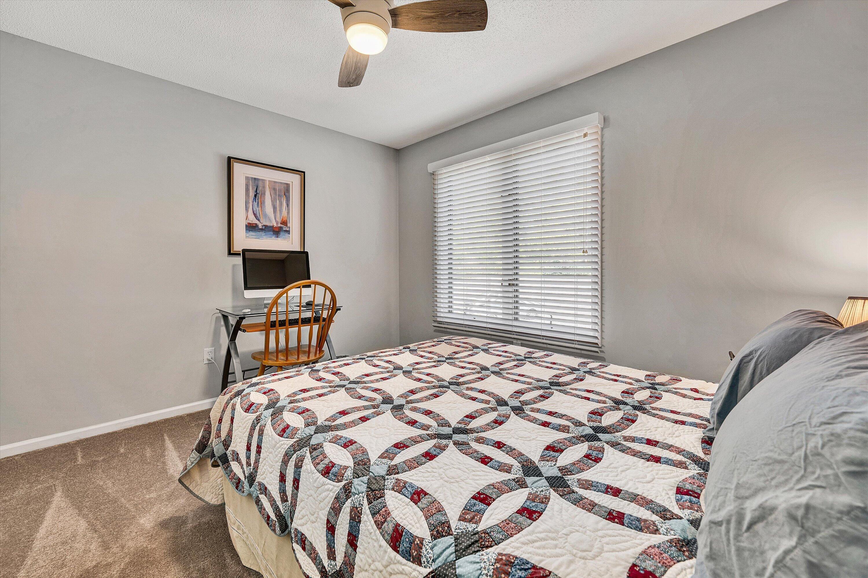 620 Monte Vista Road, Unit 605 Union Hall, VA 24176 - Photo 20 of 41 a bedroom with a bed and a chandelier