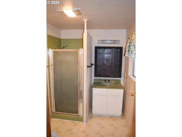 a bathroom with a sink and mirror