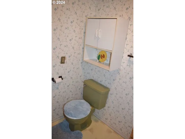 a bathroom with a toilet and a sink