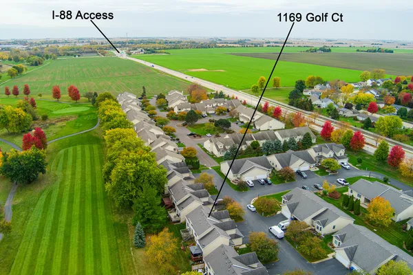 a view of a house with backyard sitting area and garden