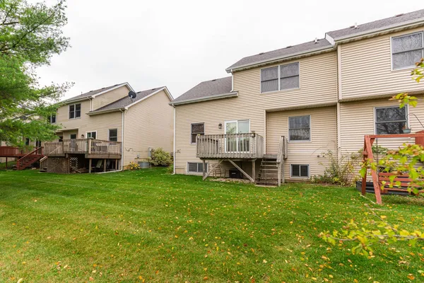 a view of balcony with wooden floor and fence