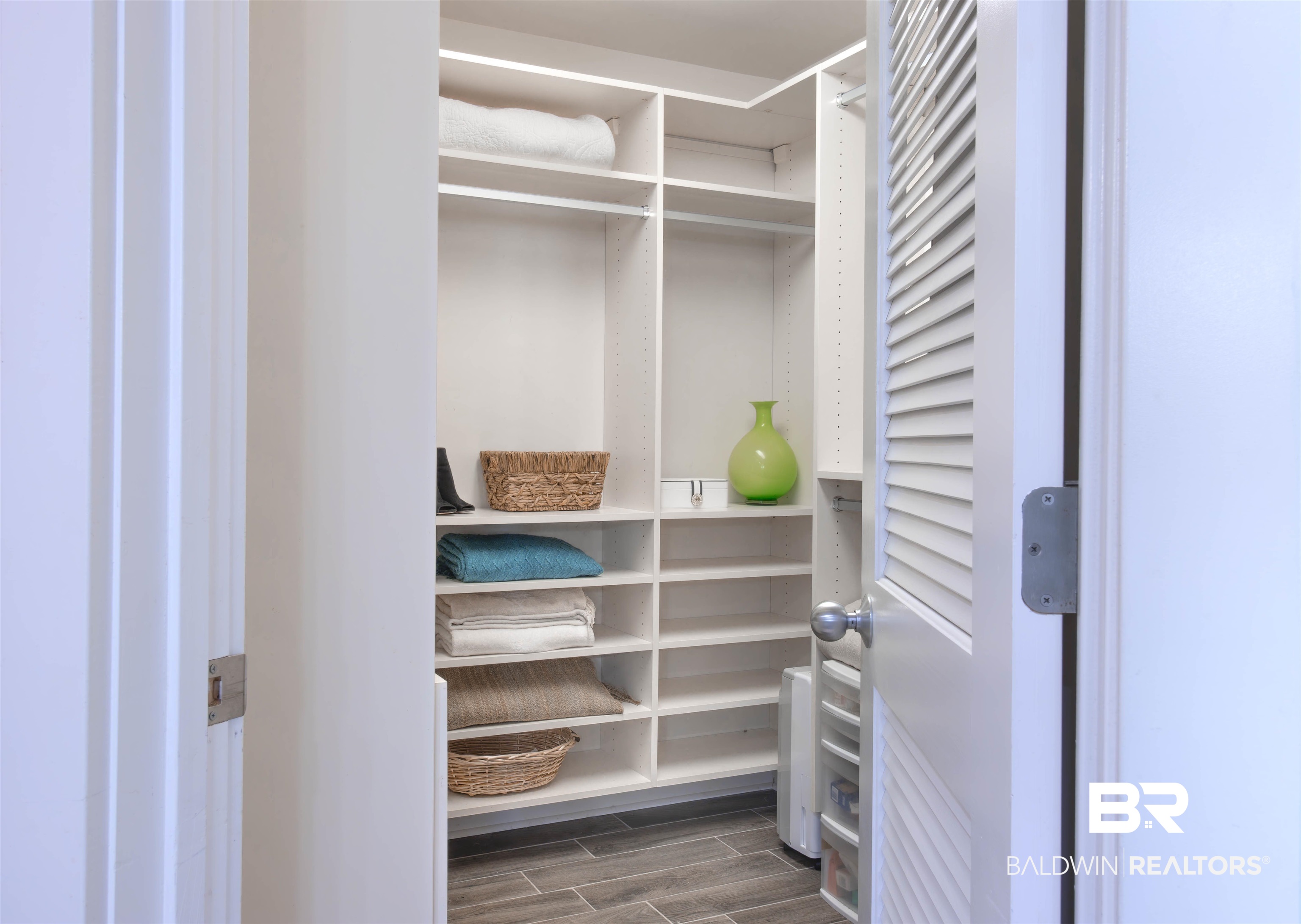 28107 Perdido Beach Boulevard, Unit D714 Orange Beach, AL 36561 - Photo 35 of 88 Spacious closet featuring wood finish floors